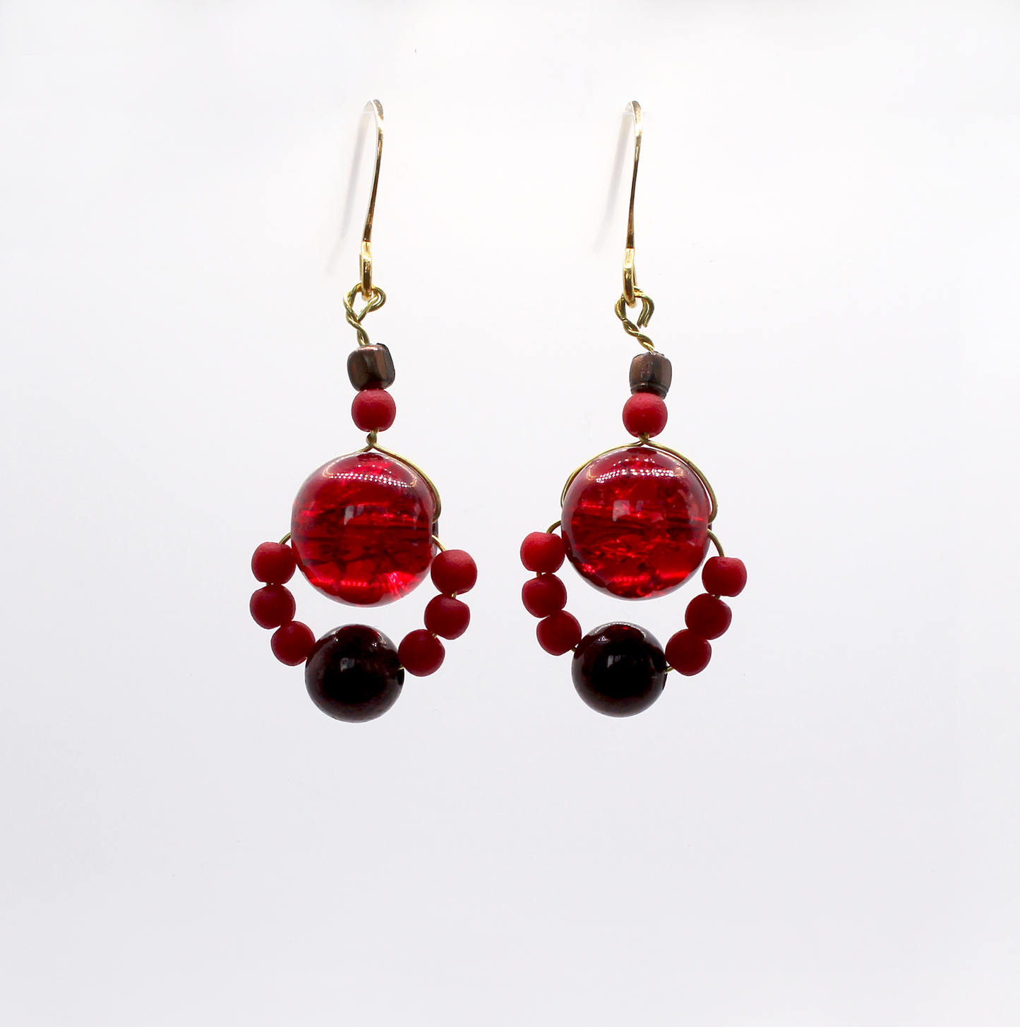 Handmade ruby red earrings made with vintage glass beads and small opaque stones.